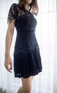A lace pleated black dress